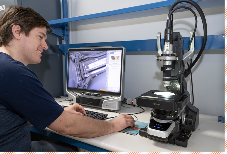 employee working with computer microscope